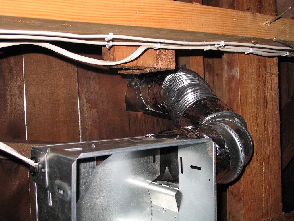 Hall bath exhaust fan duct in attic