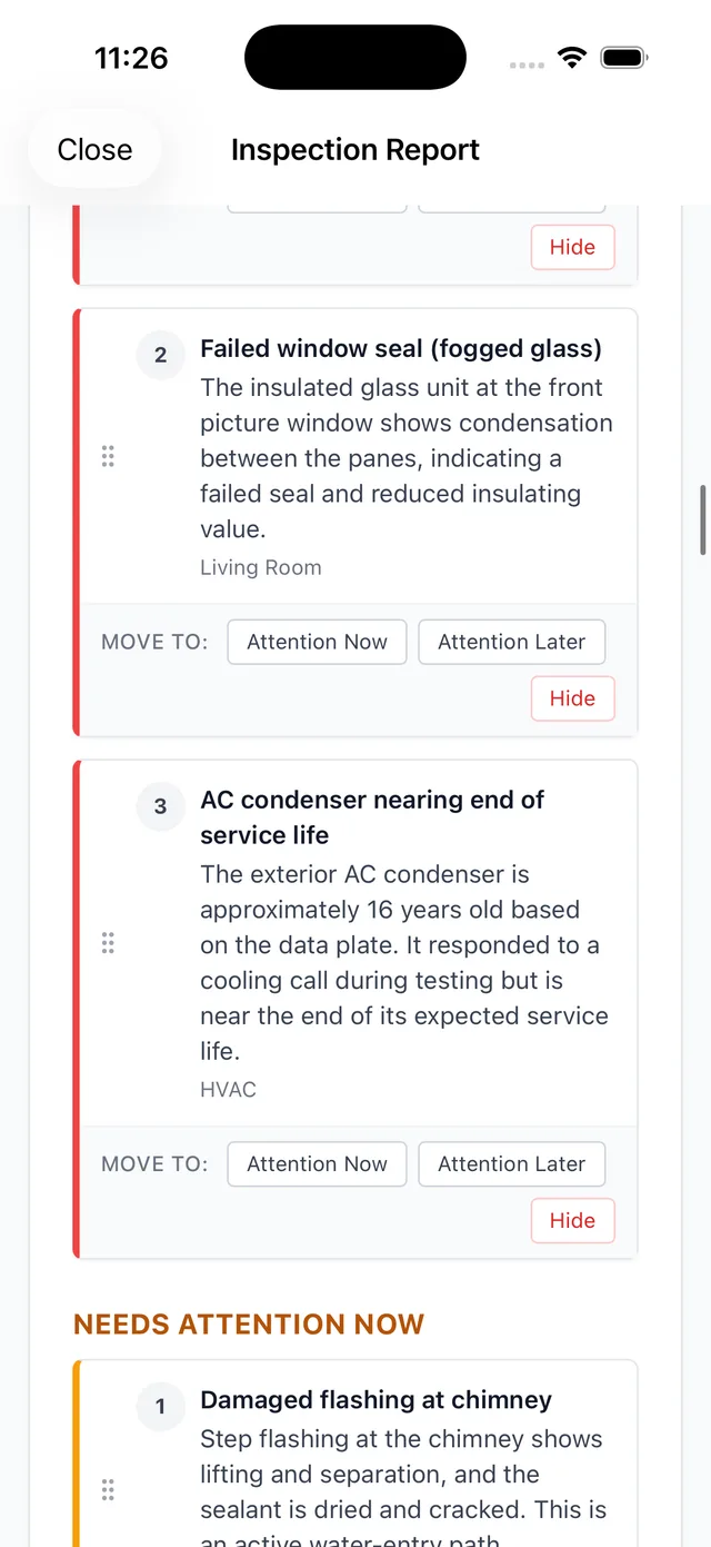 4-point-inspection-software-report-review An inspector reviewing a finished 4 point inspection report with photo evidence on an iPhone before sending it.